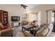 Spacious living room with ceiling fan, view of outdoor, and cozy seating area at 149 Sheryl Dr, Deltona, FL 32738