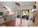 Living room with a view of the pool, fireplace, and lots of space to relax at 149 Sheryl Dr, Deltona, FL 32738