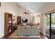 Comfortable living room featuring a large window, ceiling fan, and cozy seating area at 149 Sheryl Dr, Deltona, FL 32738