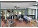 Inviting covered patio featuring tile flooring, ceiling fan and comfortable seating area perfect for relaxing and entertaining at 149 Sheryl Dr, Deltona, FL 32738