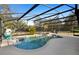 Inviting pool featuring a screened enclosure, patio, and a lounge area perfect for enjoying the outdoors at 149 Sheryl Dr, Deltona, FL 32738