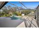 Stunning pool area featuring a screened enclosure, patio, and a lounge area perfect for enjoying the outdoors at 149 Sheryl Dr, Deltona, FL 32738