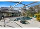 Stunning pool area featuring a screened enclosure, patio, and a lounge area perfect for enjoying the outdoors at 149 Sheryl Dr, Deltona, FL 32738