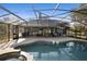 Stunning pool area featuring a screened enclosure, patio, and a lounge area perfect for enjoying the outdoors at 149 Sheryl Dr, Deltona, FL 32738
