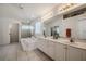 Bright bathroom featuring a soaking tub, separate shower, and double vanity with ample counter space at 163 Chrysanthemum Dr, Ormond Beach, FL 32174