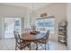 Bright dining area with backyard view and tile floors, perfect for Gathering meals at 163 Chrysanthemum Dr, Ormond Beach, FL 32174