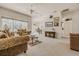 Spacious living area with natural light, ceiling fan, and open floor plan connecting to dining area at 163 Chrysanthemum Dr, Ormond Beach, FL 32174