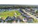 Neighborhood view with various houses and open green space at 164 E Fiesta Key Loop, Deland, FL 32720