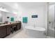 Elegant bathroom with soaking tub, double vanity, and walk-in shower at 164 E Fiesta Key Loop, Deland, FL 32720