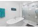 Bathroom with a large soaking tub and walk-in shower at 164 E Fiesta Key Loop, Deland, FL 32720