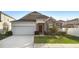 Charming one-story home with stone accents and landscaped yard at 164 E Fiesta Key Loop, Deland, FL 32720