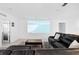 Spacious living room with sectional sofa and projection screen at 164 E Fiesta Key Loop, Deland, FL 32720