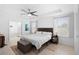 Main bedroom with king-size bed and en-suite bathroom at 164 E Fiesta Key Loop, Deland, FL 32720