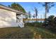 Backyard view showing the lake and stairs leading to the covered porch at 177 Rosedale Dr, Deltona, FL 32738