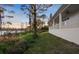 Backyard view showing the lake and covered porch at 177 Rosedale Dr, Deltona, FL 32738