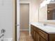 Bright bathroom featuring a modern vanity, plus a door leading to the shower at 177 Rosedale Dr, Deltona, FL 32738