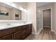 Bathroom featuring a double sink vanity and glass shower stall at 177 Rosedale Dr, Deltona, FL 32738