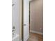 Bright bathroom with a shower and a door to another room in the house at 177 Rosedale Dr, Deltona, FL 32738