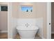 Soaking tub with tile surround, creating a cozy and luxurious retreat at 177 Rosedale Dr, Deltona, FL 32738