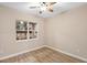 Bedroom featuring wood-look floors and a window with an outdoor view at 177 Rosedale Dr, Deltona, FL 32738