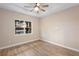 Bedroom with a large window offering serene lake view at 177 Rosedale Dr, Deltona, FL 32738