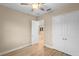 Bedroom with a ceiling fan and wood-look flooring, plus a closet at 177 Rosedale Dr, Deltona, FL 32738