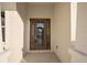 Close up view of a beautifully crafted front door with glass panels for natural light at 177 Rosedale Dr, Deltona, FL 32738