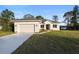 Charming single-story home with a well-manicured lawn and attached two car garage at 177 Rosedale Dr, Deltona, FL 32738