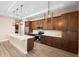 Modern kitchen featuring custom cabinets and an island with white countertop at 177 Rosedale Dr, Deltona, FL 32738