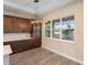Elegant kitchen with dark cabinets and a window overlooking the backyard at 177 Rosedale Dr, Deltona, FL 32738