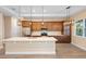 Bright kitchen with stainless steel appliances, center island, and decorative pendant lighting at 177 Rosedale Dr, Deltona, FL 32738