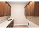 Laundry room featuring cabinetry, a sink, and connections for laundry machines at 177 Rosedale Dr, Deltona, FL 32738