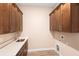 Laundry room featuring cabinetry, a sink, and space for a washer and dryer at 177 Rosedale Dr, Deltona, FL 32738