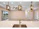 Bright and airy living room with a view and modern lighting at 177 Rosedale Dr, Deltona, FL 32738
