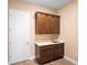 Mud room featuring cabinetry, a sink, and a white door at 177 Rosedale Dr, Deltona, FL 32738
