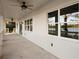 Covered outdoor patio overlooks a serene lake, offering peaceful views from the property at 177 Rosedale Dr, Deltona, FL 32738