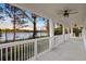 Spacious outdoor porch with ceiling fans and a scenic lake view at 177 Rosedale Dr, Deltona, FL 32738