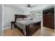 Well-lit main bedroom with wood flooring and serene decor at 1944 Poinsettia Dr, Port Orange, FL 32128