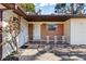 Front entrance with brick facade and decorative railing at 2001 Mike St, South Daytona, FL 32119