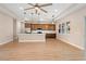 Modern kitchen with stainless steel appliances, large island, and stylish pendant lighting at 2060 Watersedge Dr, Deltona, FL 32738