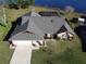 Beautiful waterfront home with well-manicured lawn, screened in patio, and attached two car garage at 2075 Little Farms Ct, Deltona, FL 32738