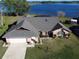 Beautiful waterfront home with well-manicured lawn, and attached two car garage at 2075 Little Farms Ct, Deltona, FL 32738