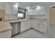 Bright kitchen with modern stainless steel appliances, ample cabinet space, and a lovely backyard view at 2075 Little Farms Ct, Deltona, FL 32738