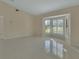 Spacious living area boasting tile floors, shuttered windows, and neutral color scheme at 2075 Little Farms Ct, Deltona, FL 32738