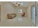 Bright living room featuring a skylight, tile floors, access to pool area, and a relaxed seating arrangement at 2075 Little Farms Ct, Deltona, FL 32738