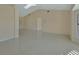 Bright and airy living space with vaulted ceiling, tile floors, and plenty of natural light at 2075 Little Farms Ct, Deltona, FL 32738