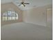 Vaulted ceiling bedroom with large window and neutral carpet at 2075 Little Farms Ct, Deltona, FL 32738