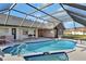 Enclosed pool boasts a large pool and spa, bar, and outdoor seating, creating an ideal entertainment and relaxation space at 2075 Little Farms Ct, Deltona, FL 32738