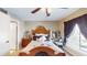 Cozy bedroom with a wooden bed frame and window seat at 210 Orienta Point St # 210, Altamonte Springs, FL 32701