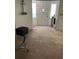 Inviting foyer featuring bright natural light from the front windows and a stylish front door at 2201 S Peninsula Dr, Daytona Beach, FL 32118